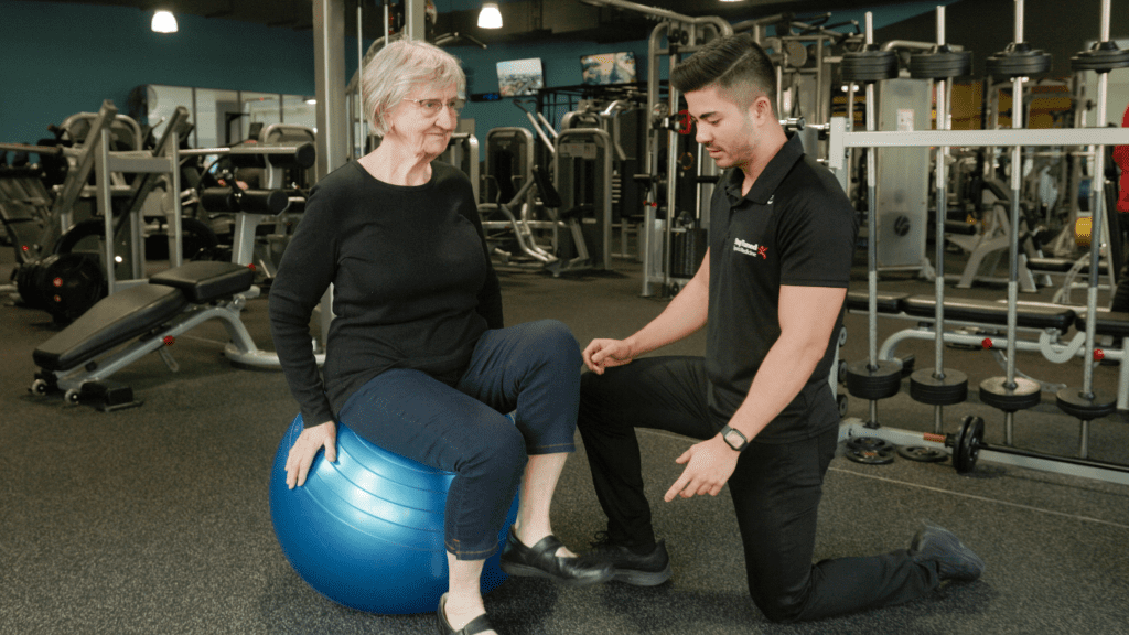 dr micahel caruana assisting someone at risk of osteoporosis